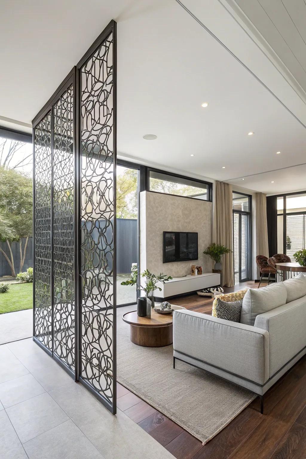 An elegant metal partition creates designated areas in a spacious living room.