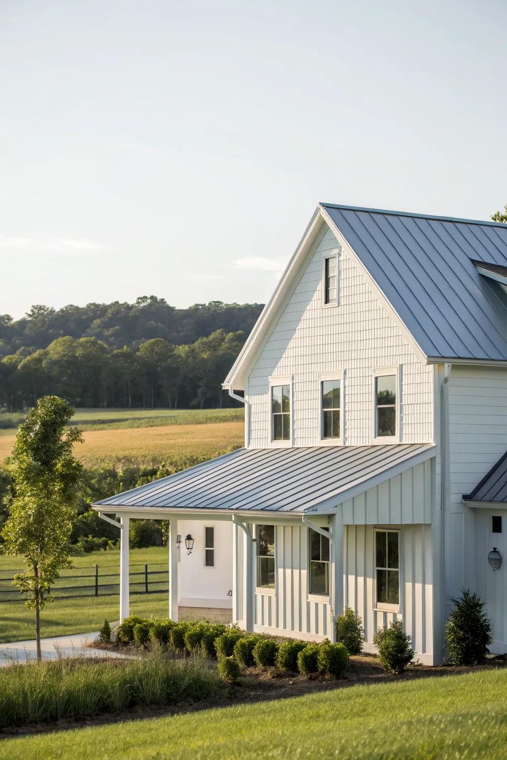 A contemporary farmhouse featuring white vinyl siding and a polished metallic roof.