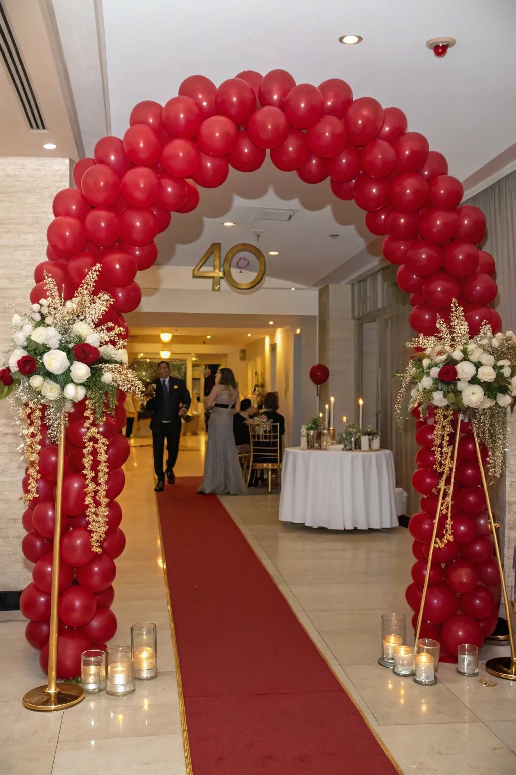 A ruby-themed balloon archway makes a grand entrance.