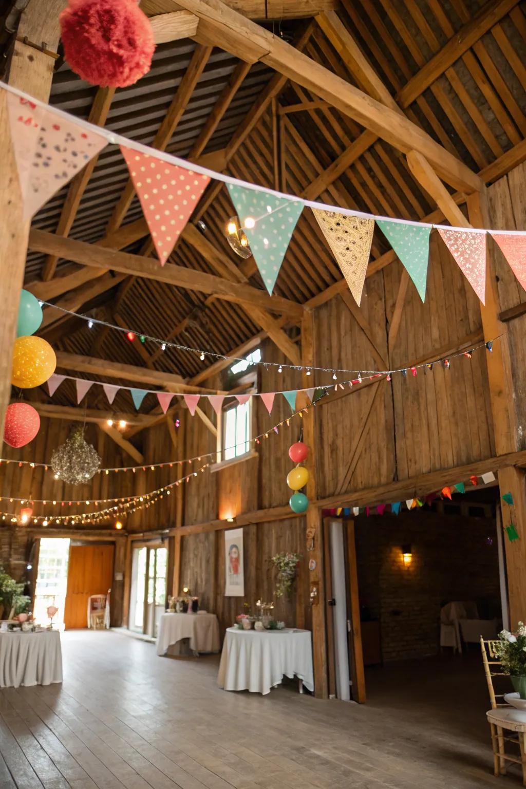 Festive flags add a lively and celebratory vibe to the barn.