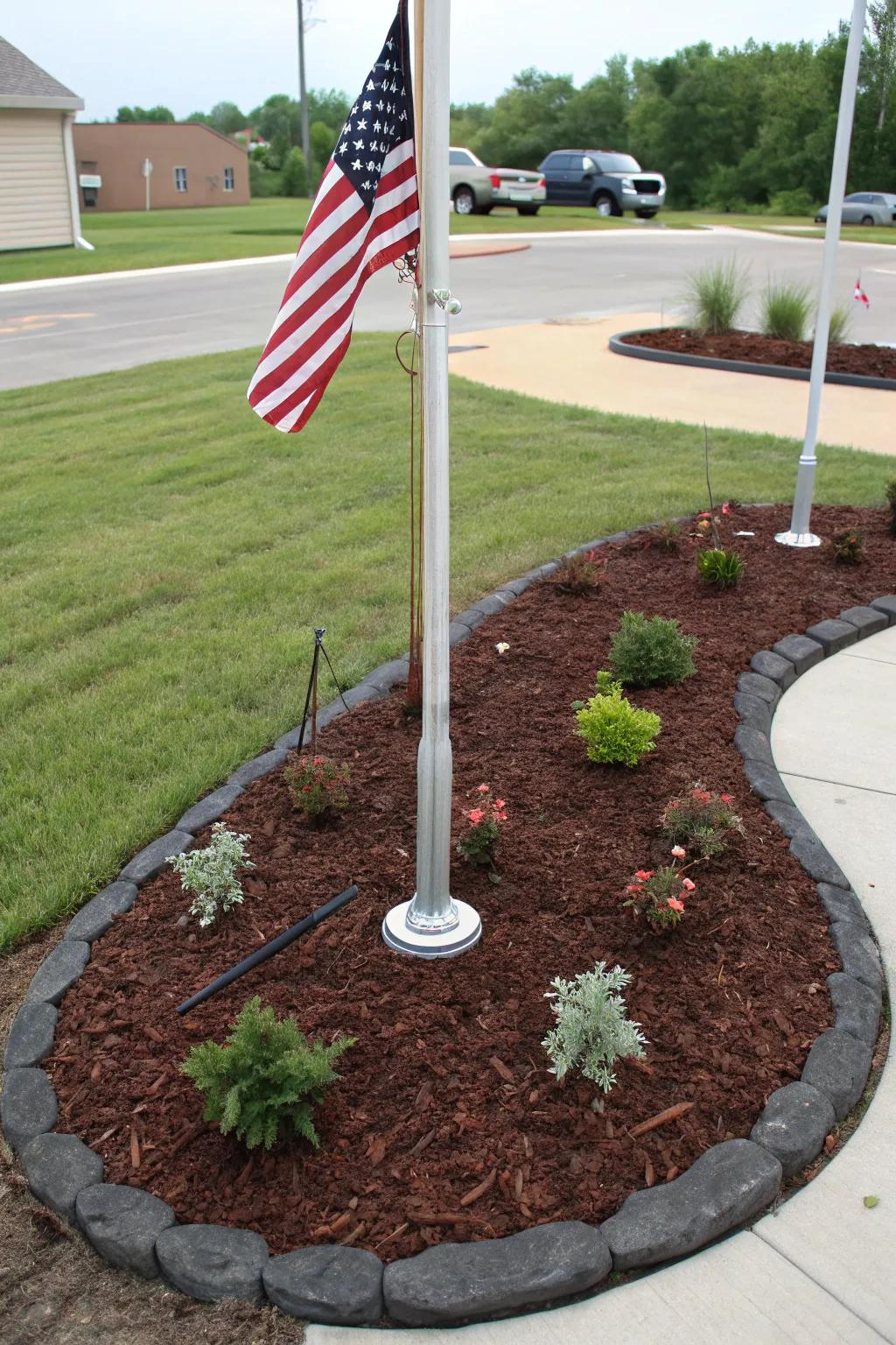 Fancy mulch adds a tidy, polished touch to a flagpole landscape.
