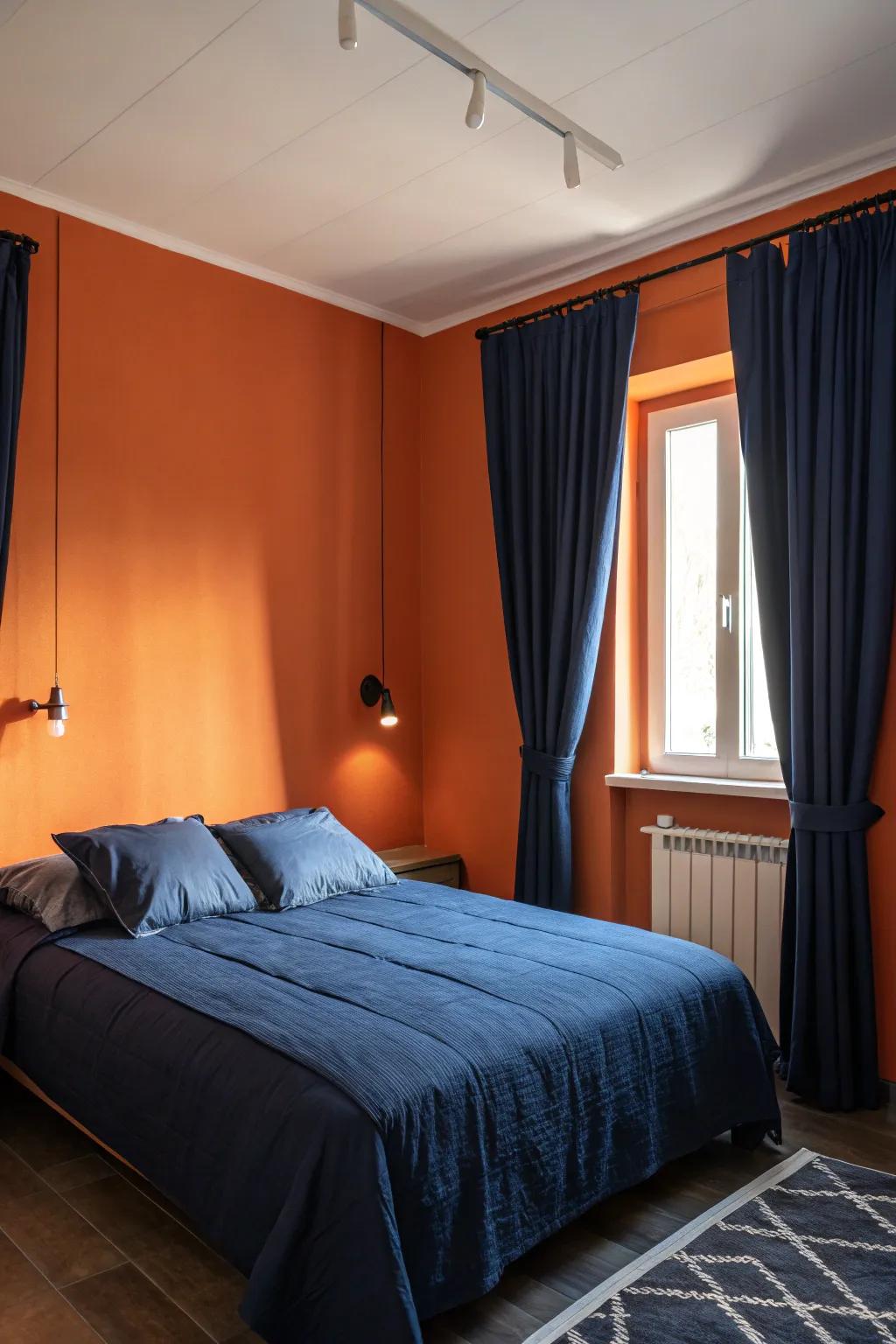 Azure features lend a tranquil contrast to daring orange walls.