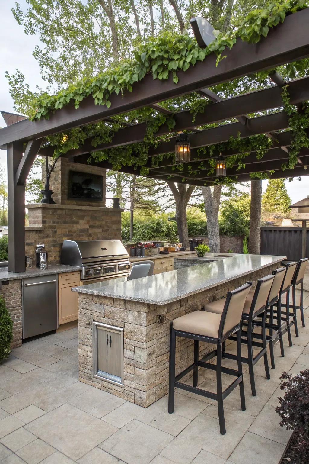 An inviting outdoor kitchen island with bar stools and a seating area under a pergola.