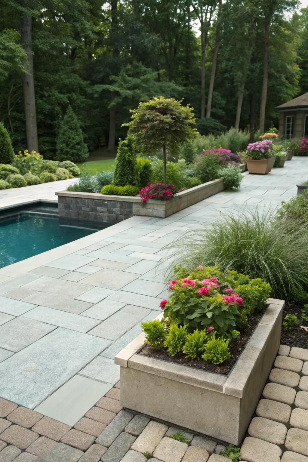 The integration of greenery alongside paving delivers a seamless transition into the garden.
