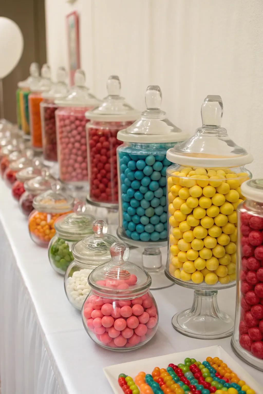 A selection of candy jars with sweets in coordinating colors.