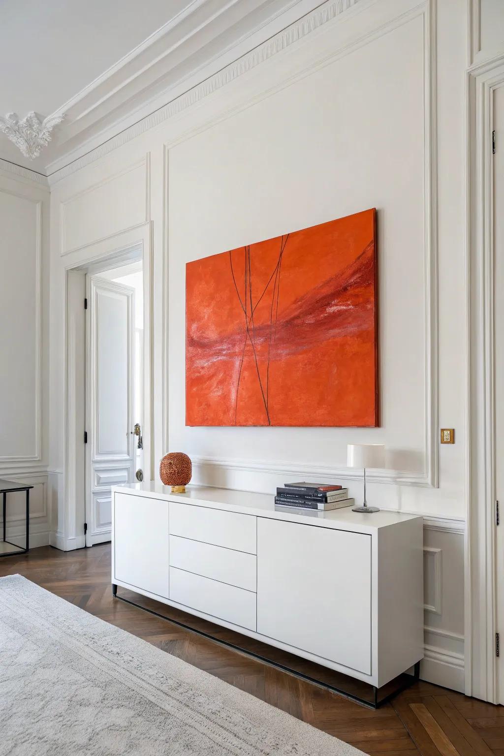 A striking piece of tangerine abstract graphics injects modern flair to a simple room.