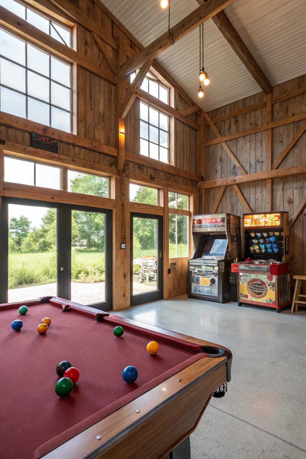 A recreation room inside a pole barn equipped with a billiards table and classic amusement devices.