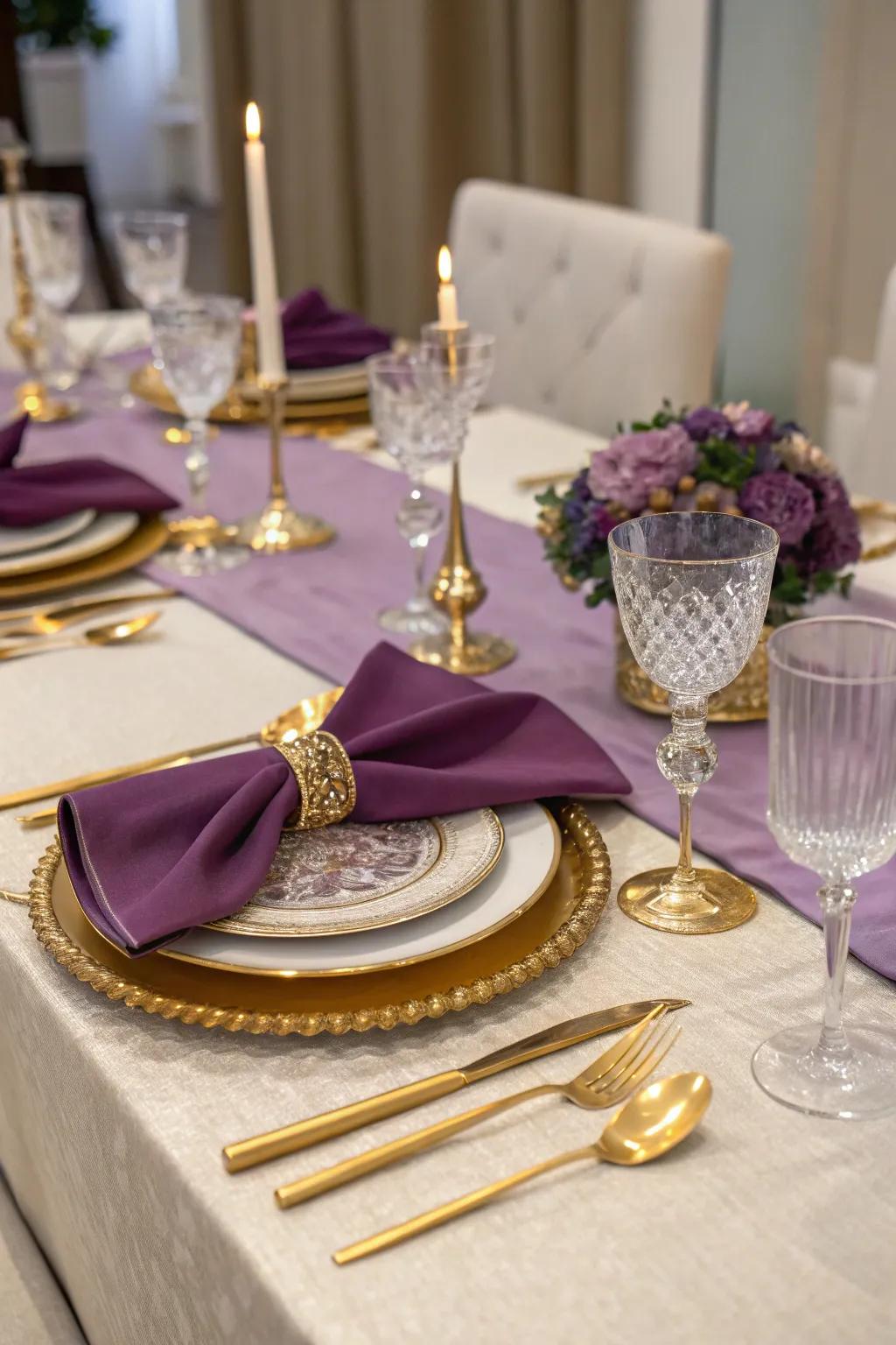 Purple and gold table settings radiate elegance and luxury.