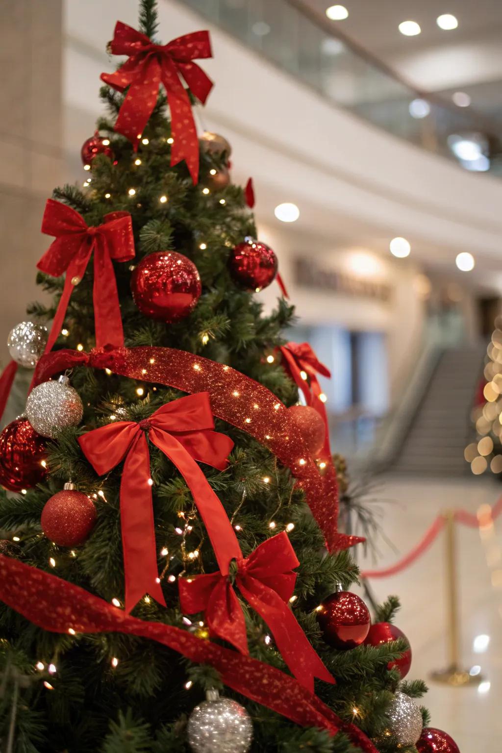 Crimson strips and tied ribbons introduce a charming element to the tree.