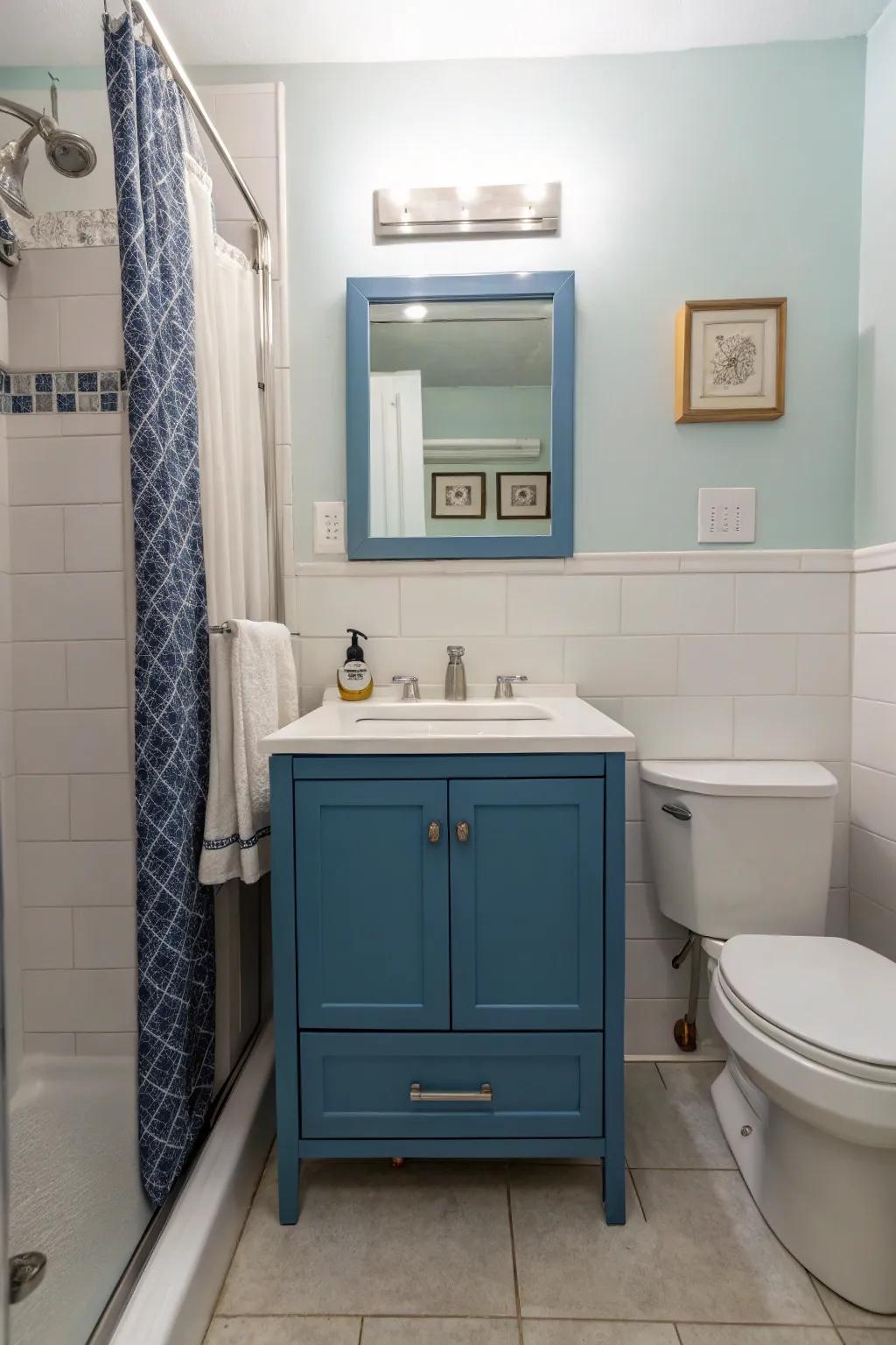 A modern blue washstand stands out as a centerpiece in this fashionable bathroom.