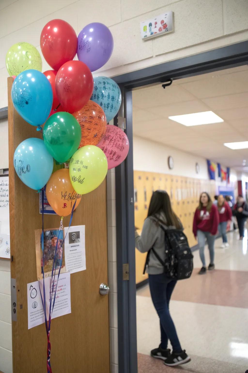 An interactive classroom door featuring balloons for students to pen kind messages.