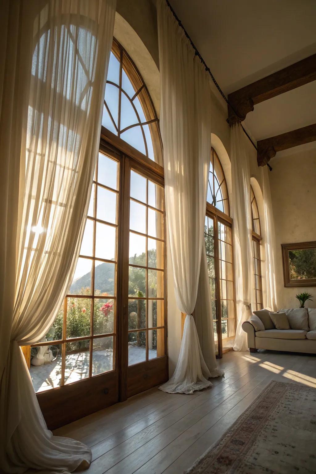 A sun-kissed room adorned with airy refinement on arched windows.