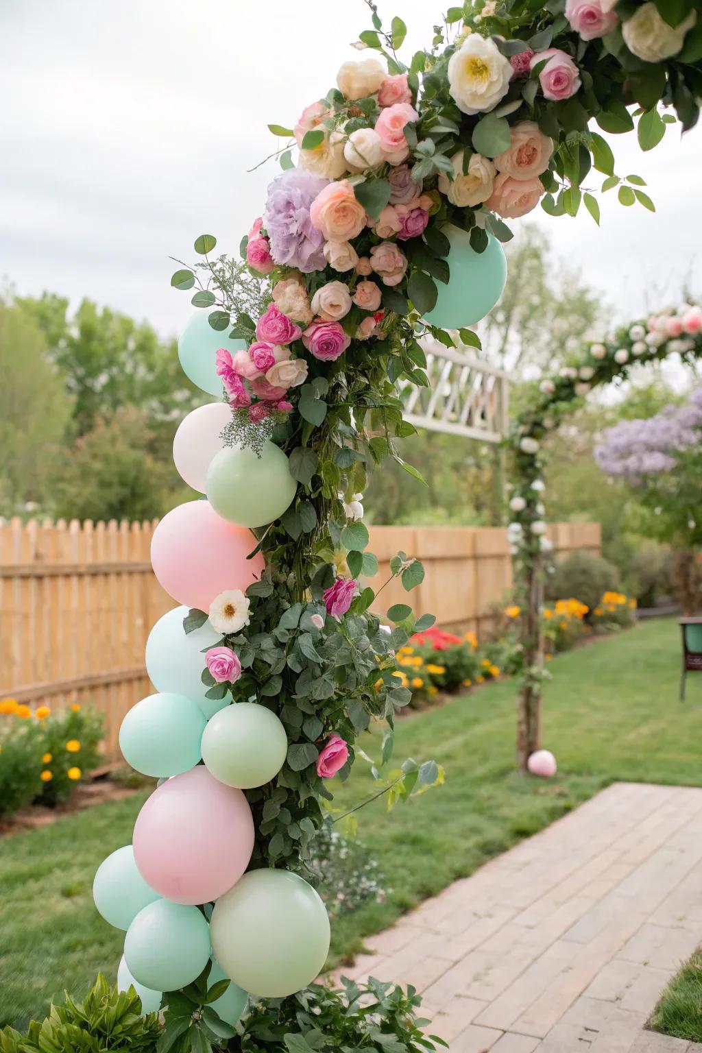 A garden chic balloon garland featuring natural elements.