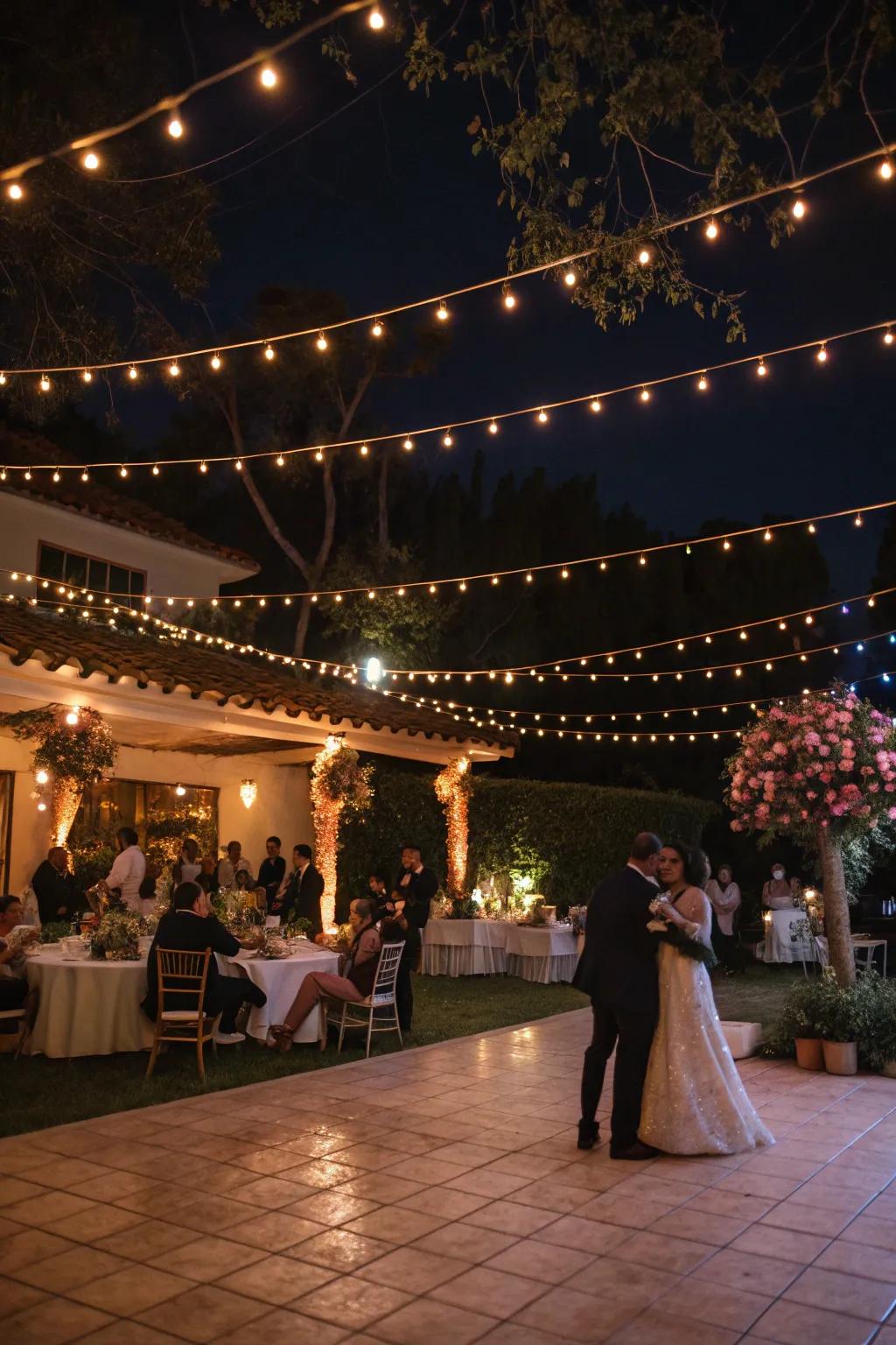 An evening wedding festivity illuminated by the gentle glow of filament lights.
