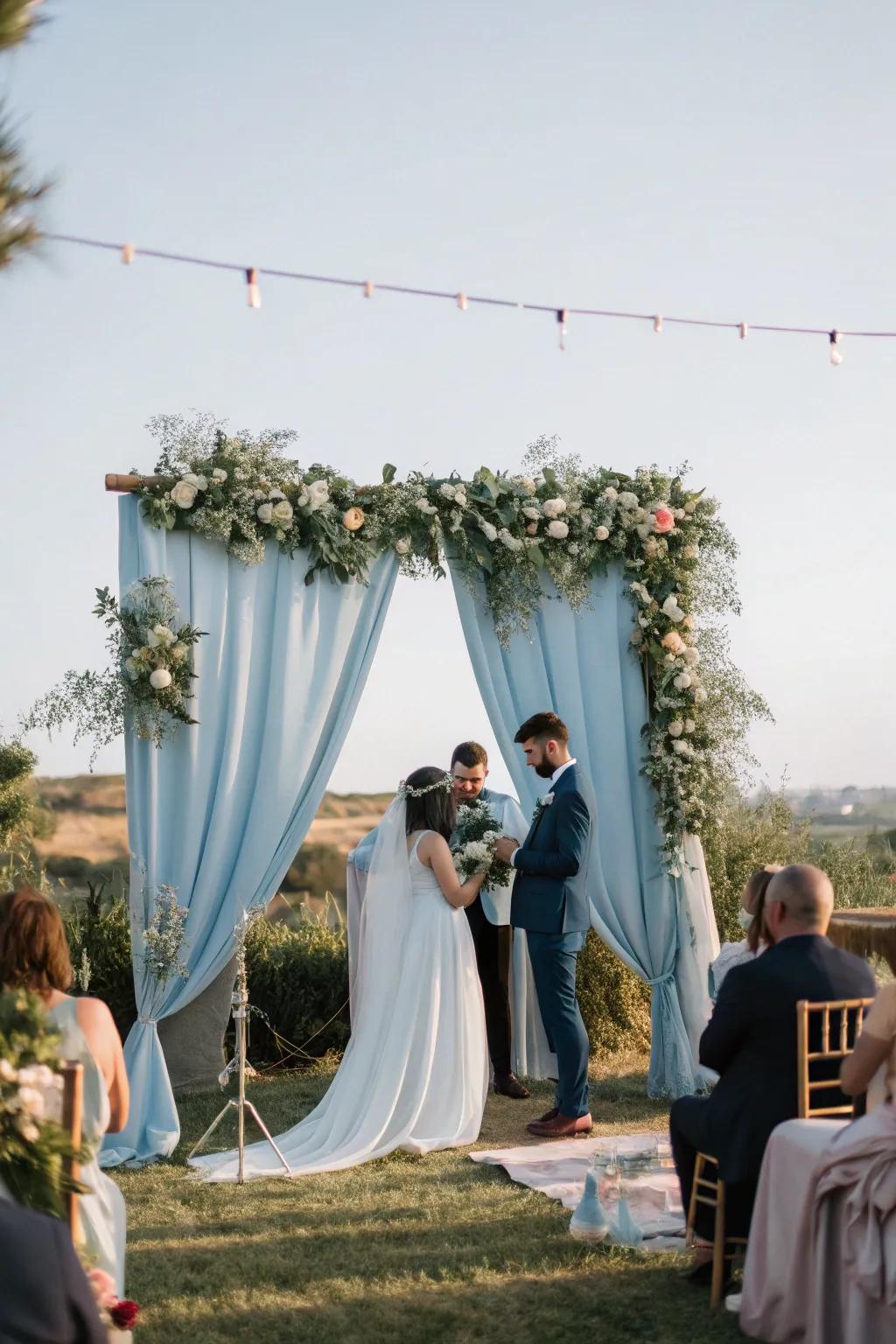 A dreamy ceremony space featuring a misty blue backdrop that enhances the romantic atmosphere.