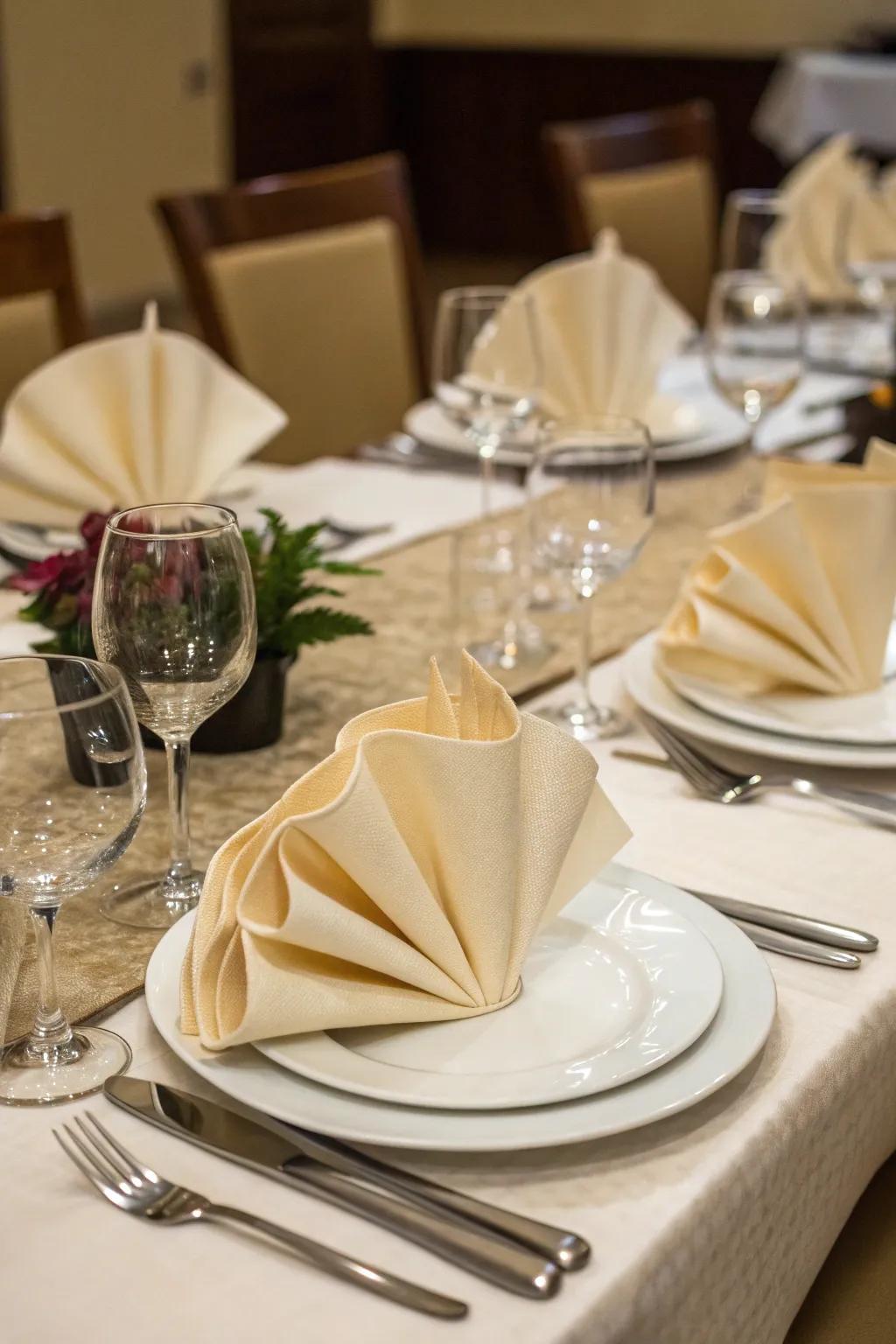 Imaginatively folded napkins add an individualized touch to the table.
