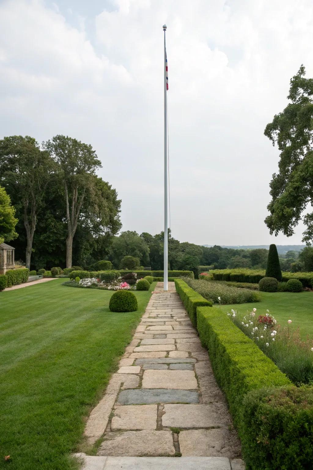 A rock footpath provides a welcoming route to a flagpole.