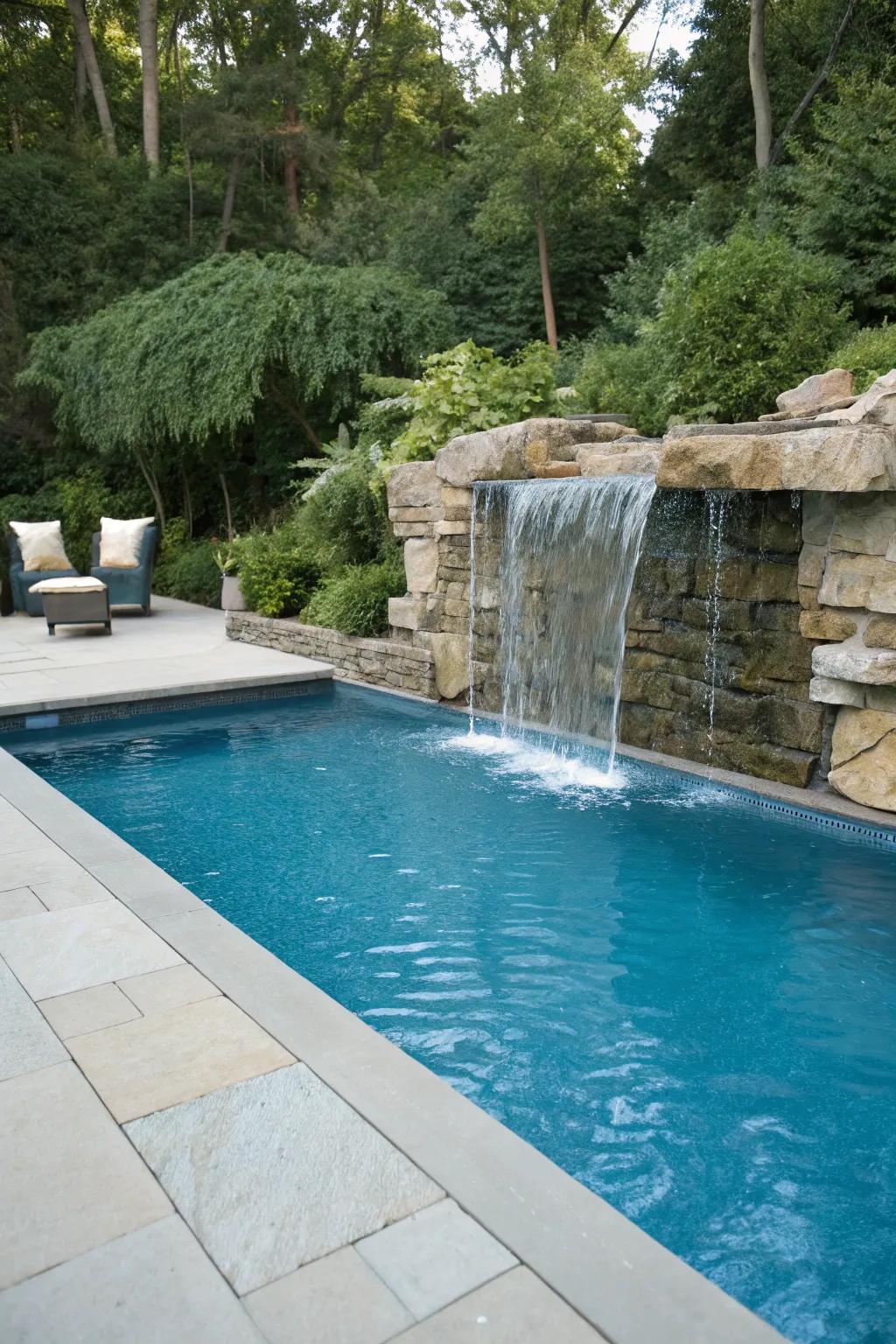 A waterfall element brings sophistication and peace to the pool.