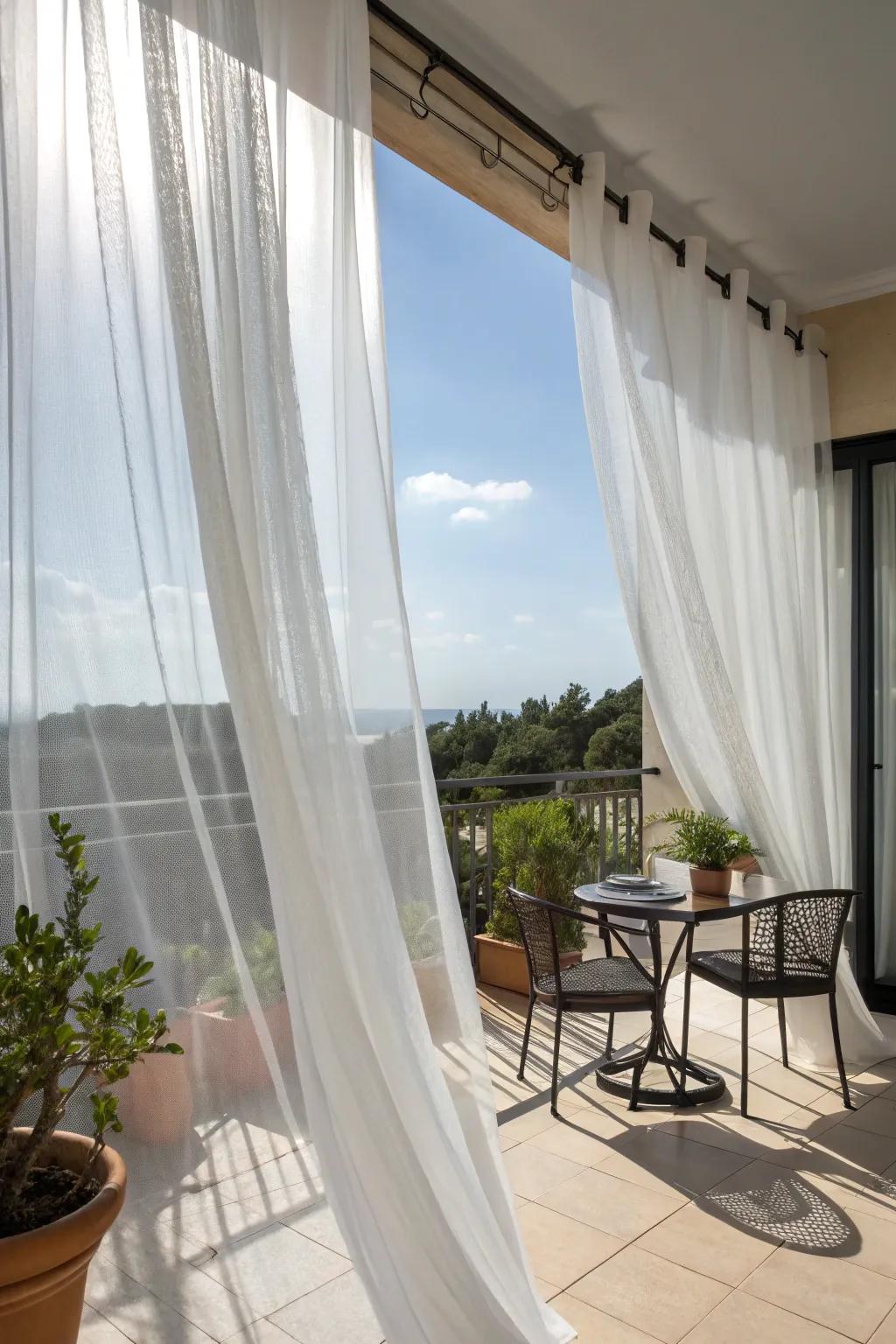 Sheer curtains creating a soft, shaded ambiance on a balcony.