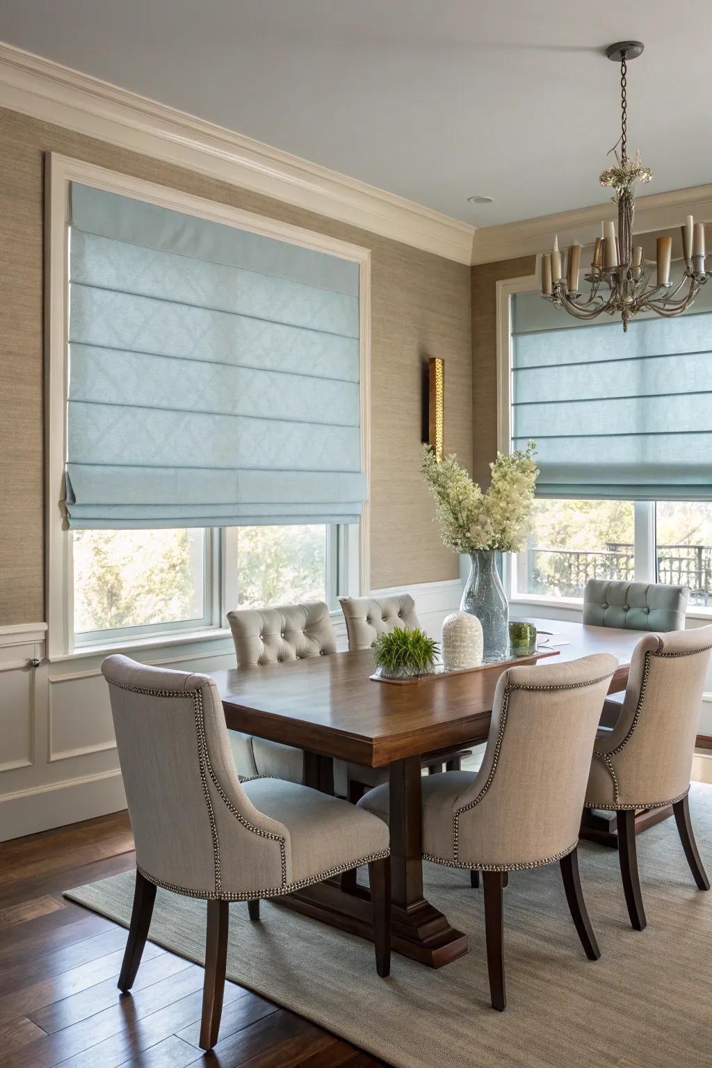 Folding shades in muted azure imparting a polished and contemporary charm to the dining area.