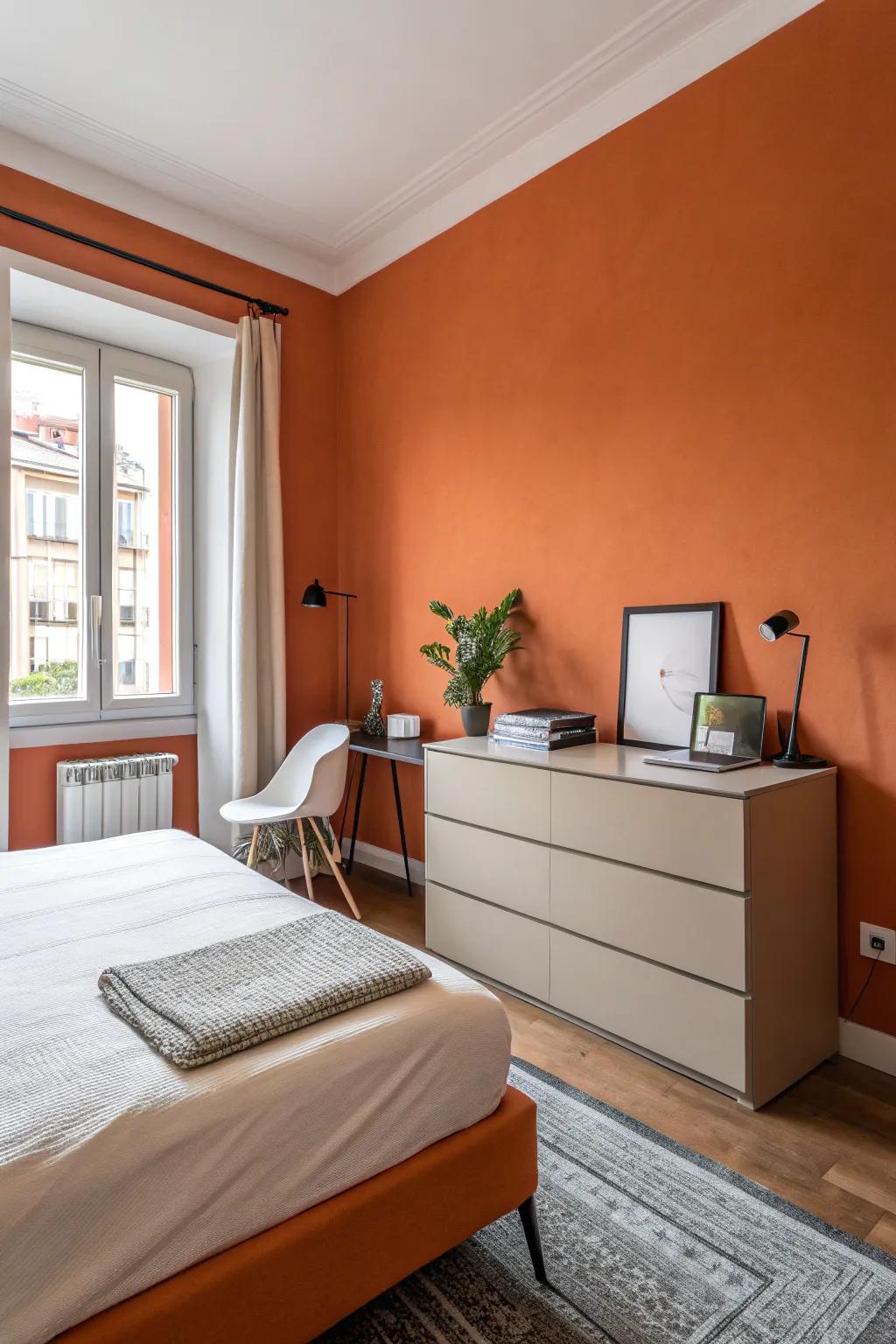 Sparse furnishings enhance the audacity of orange walls.