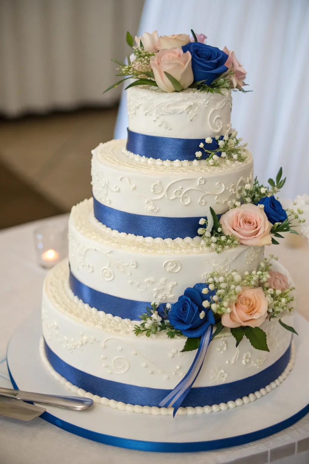 A wedding cake decorated with royal blue accents.
