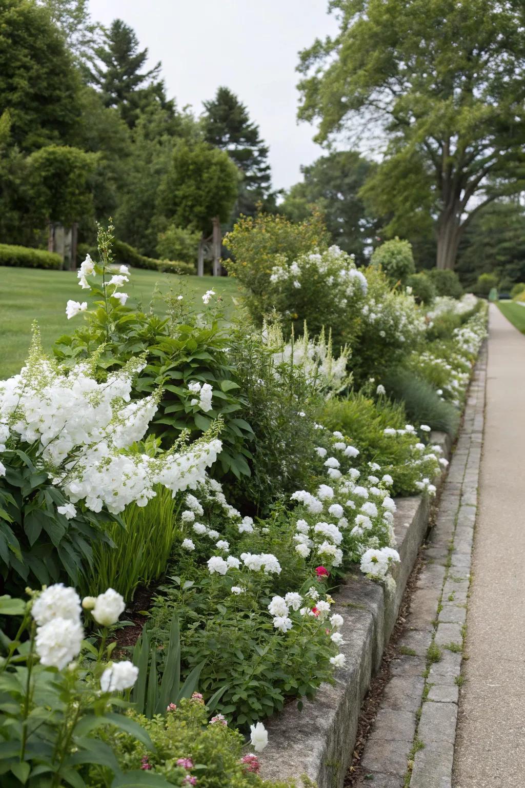 Alabaster floral borders infuse the garden with structure and refinement.