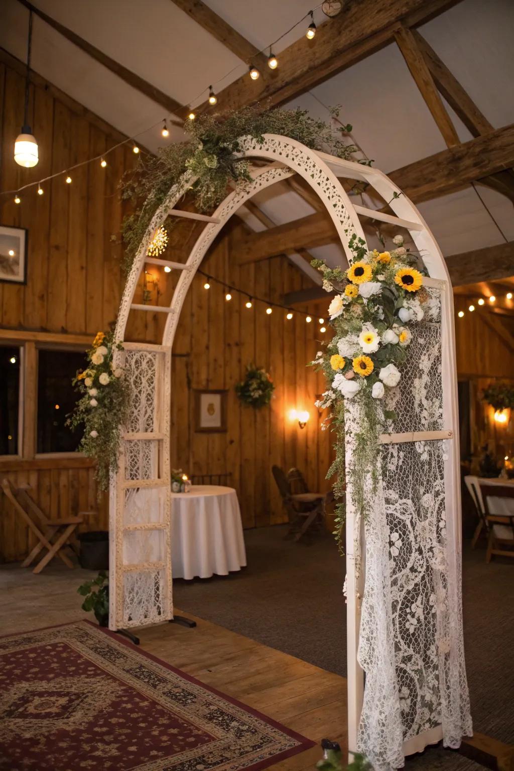A vintage-inspired arch with lace and wildflowers for a nostalgic touch.