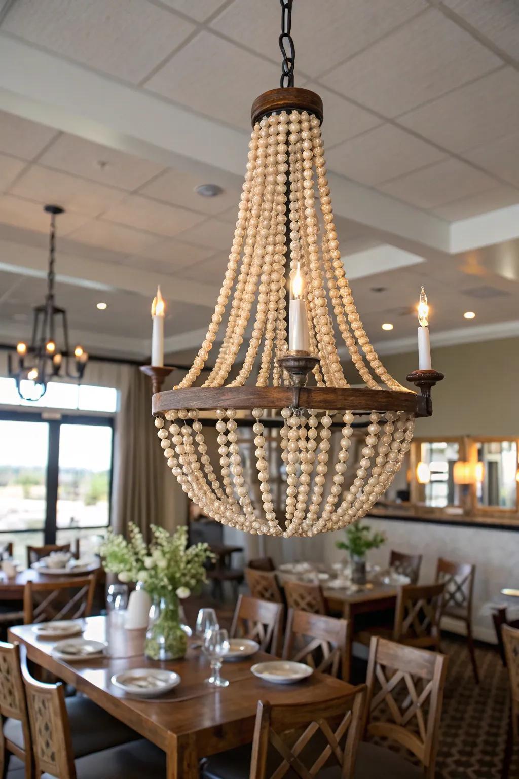Light fixture elegantly embellished with a beaded strand.