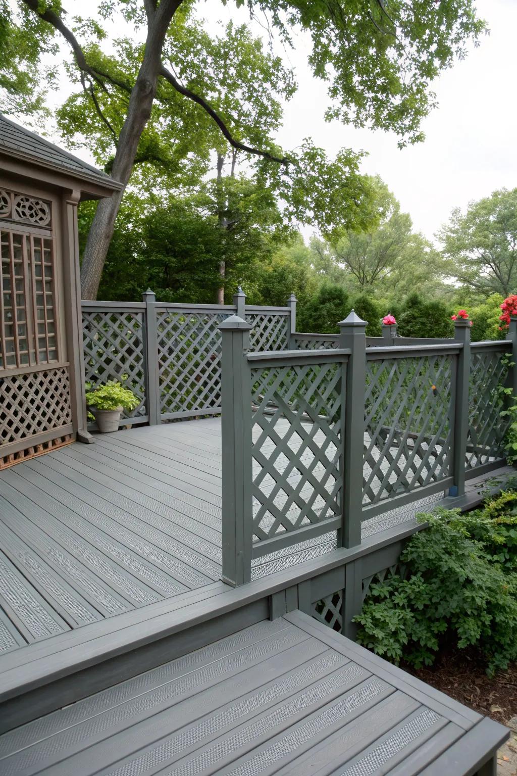 Privacy-enhancing lattice railings featured on a grey deck.