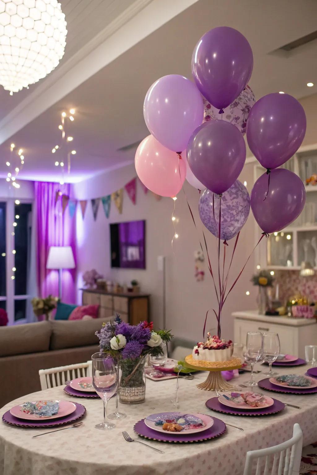 A festive celebration setting adorned with plum balloons and dinnerware.