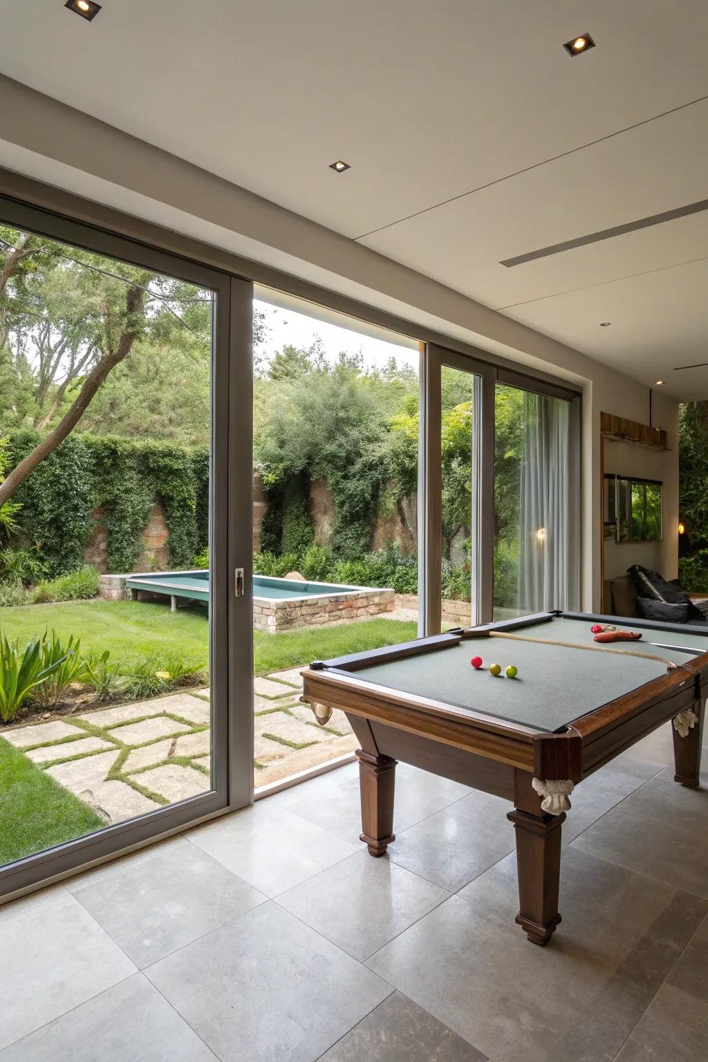 An indoor-outdoor living area with a snooker table and garden access.