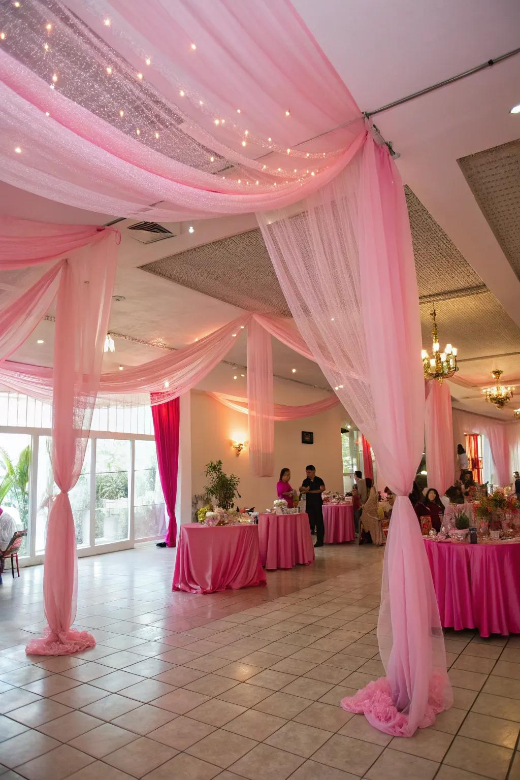 Roseate netting draping crafts a whimsical and dreamy party atmosphere.