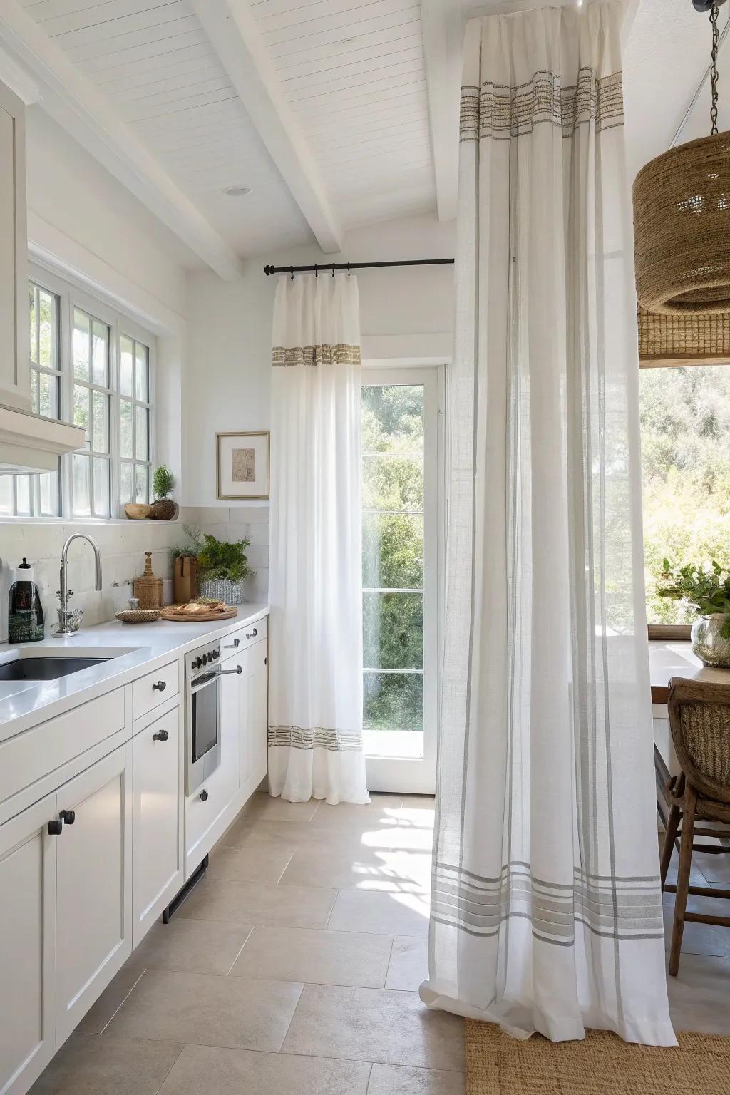 Delicate stripes on white drapes create a crisp, modern appearance in this kitchen.