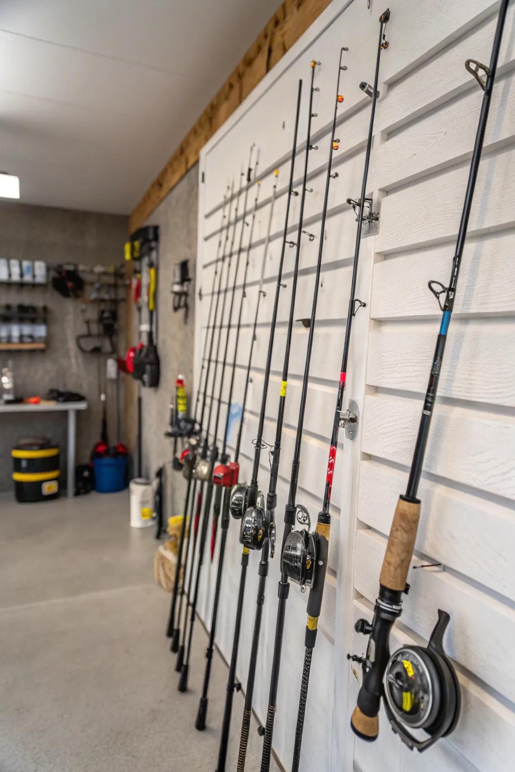 Fishing rods are stored safely and neatly on a slatwall.