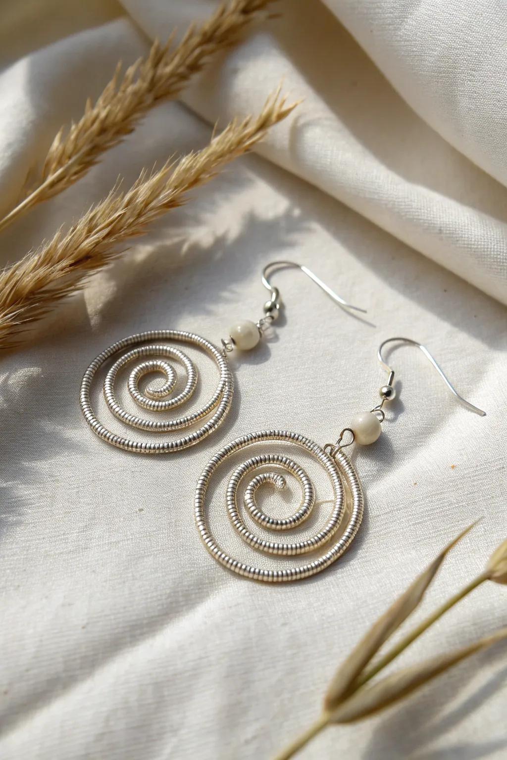 Delve into the world of simplicity with these refined coiled wire earrings, where craftsmanship converges with minimalist allure.