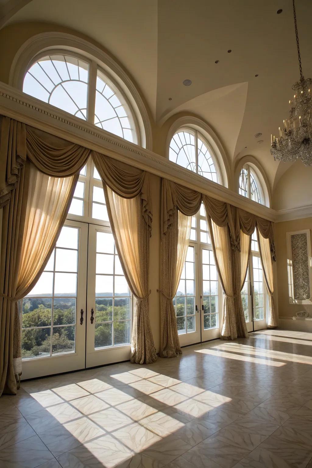 A majestic living space featuring suspended drapes on arched windows.