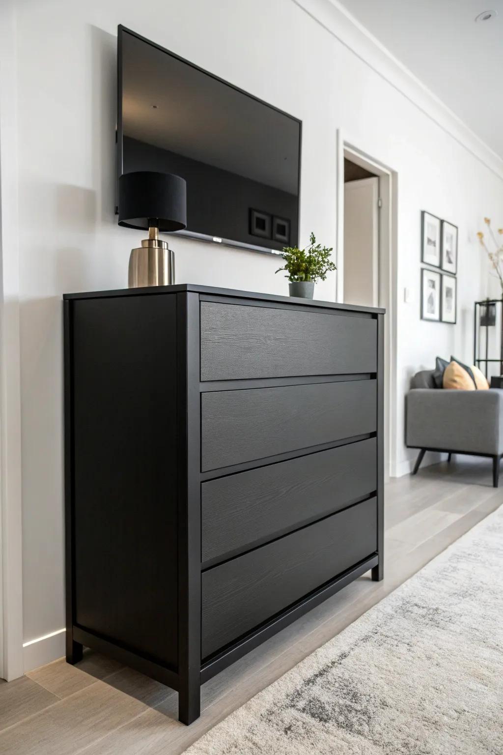 A striking contrast between a dark wood dresser and a light wall.