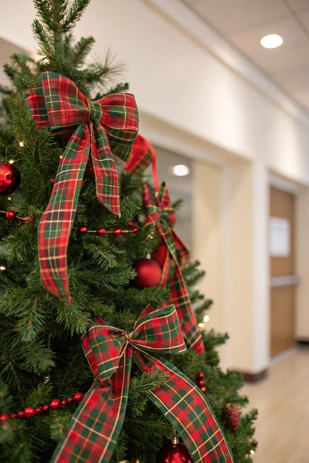 A traditional tartan-themed Christmas tree accentuated with crimson and emerald touches.