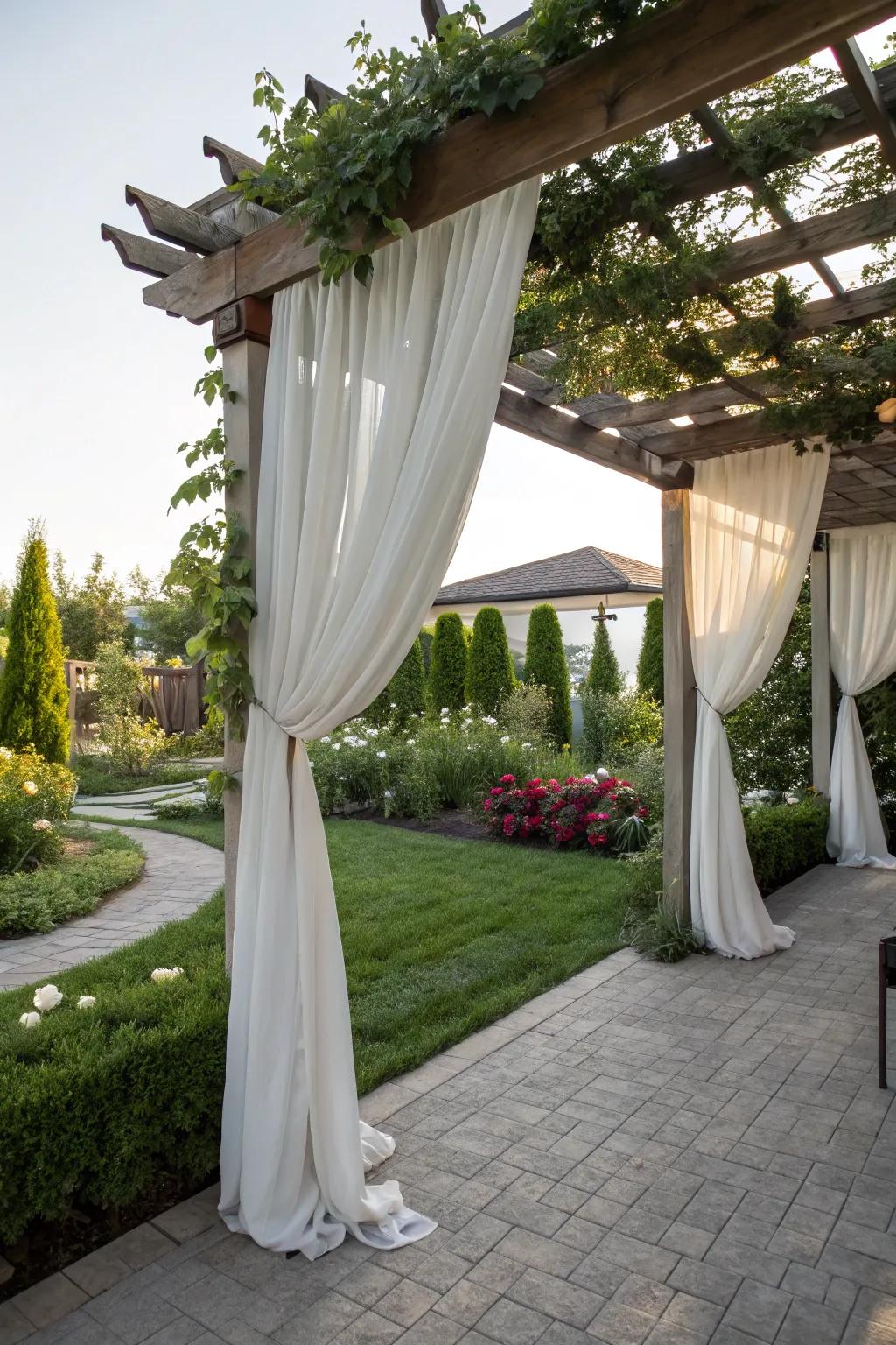 An arbor with drapery fashioning a personal outdoor haven.