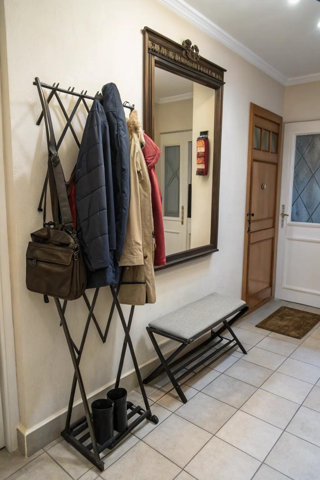 A foldable coat rack suited for amplifying area in a petite entranceway.