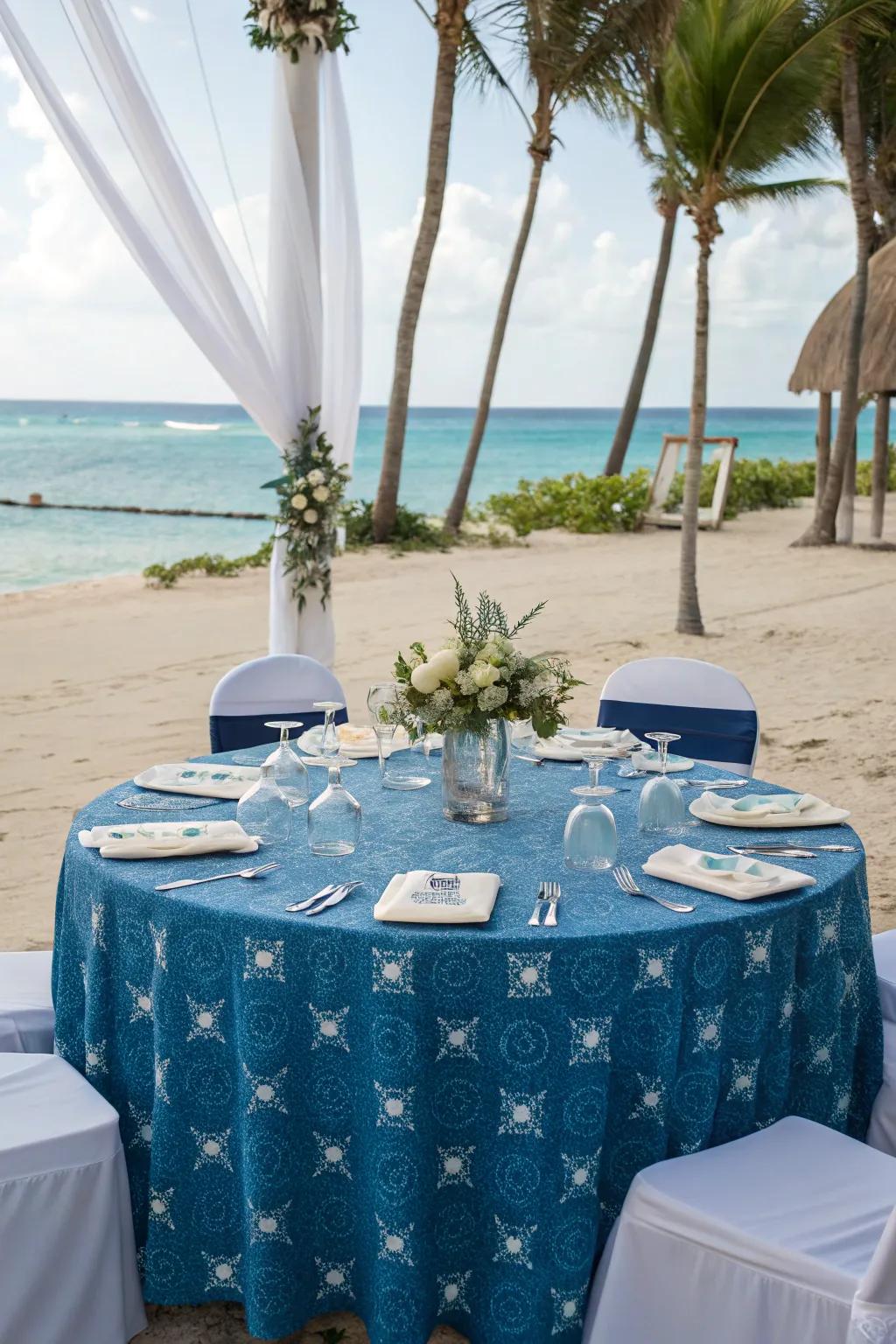 Ocean-themed tablecloth for a serene beachside wedding.